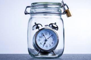 Photo of a clock inside a glass jar