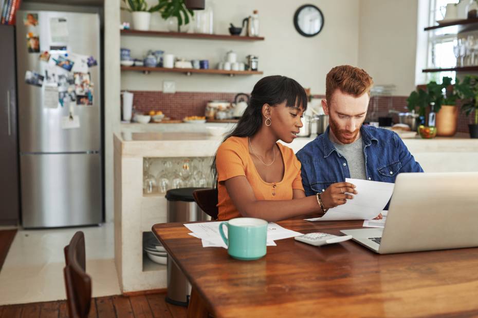 A couple reviewing bills.