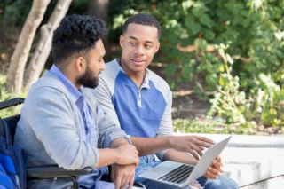 Two males dicussing banking terms