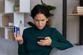 Concerned lady looking at smartphone