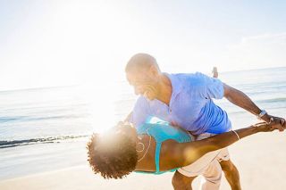 Couple dancing on beach