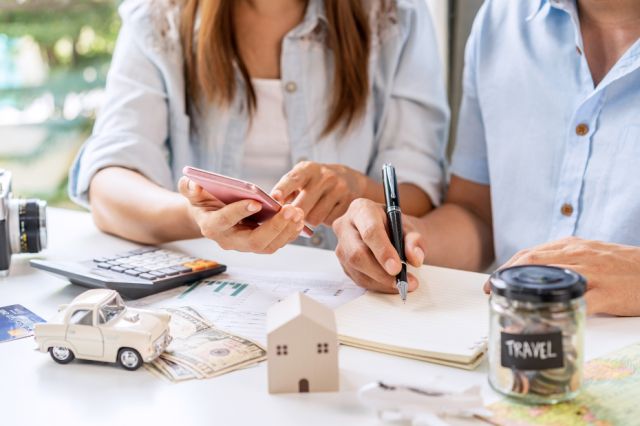 Young couple is planning and managing home expenses