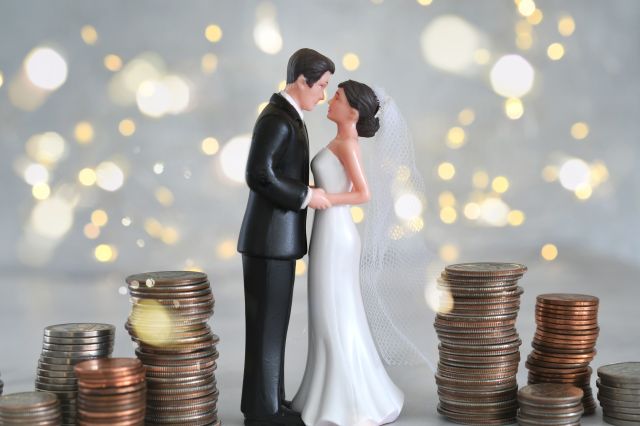 Wedding topper surrounded by coins