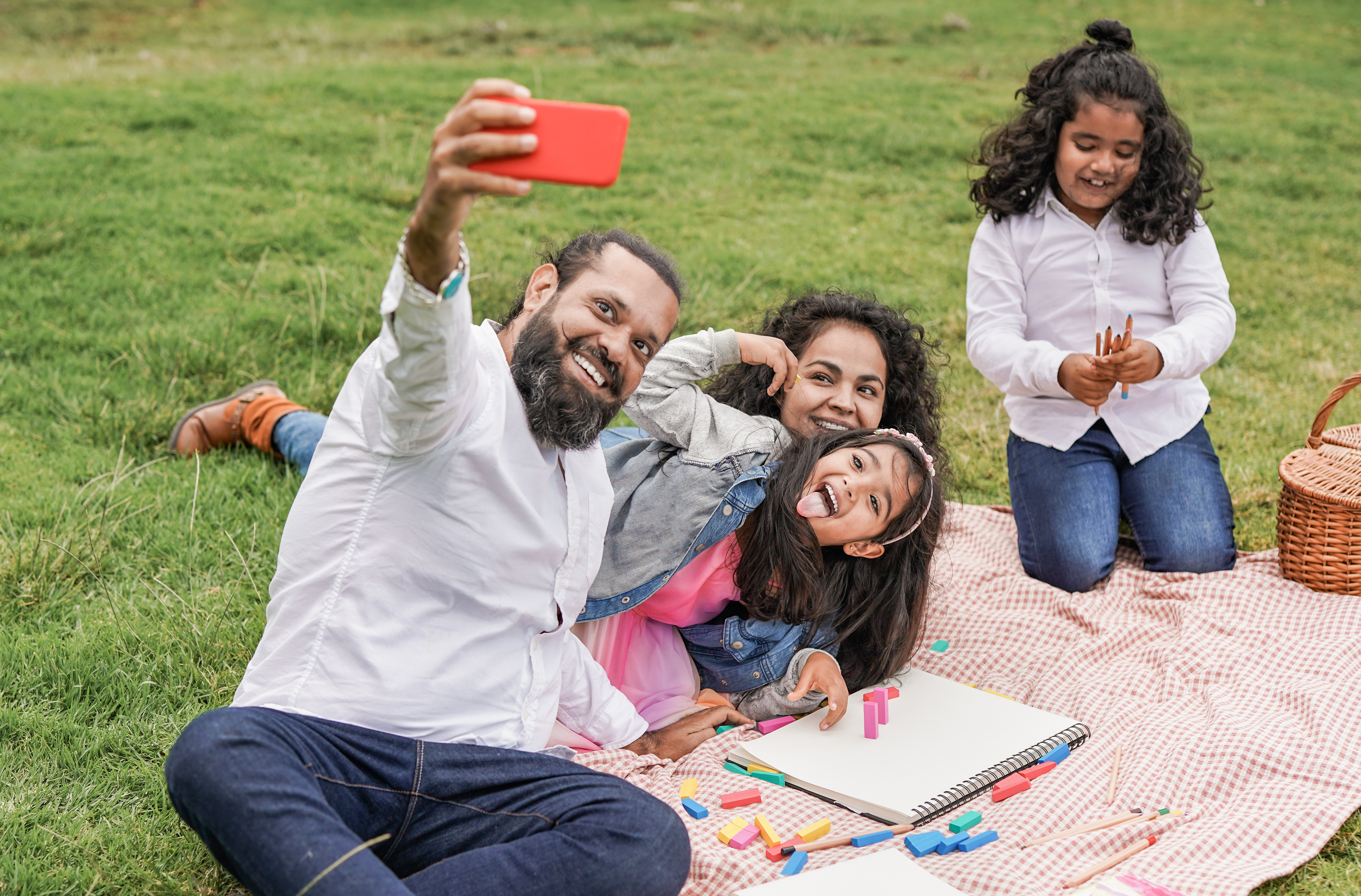 Happy family taking a picture together outside