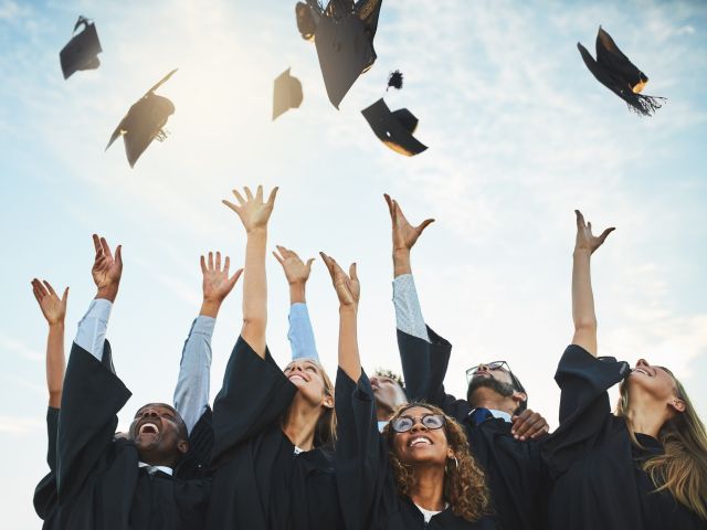 Graduation caps in the sky