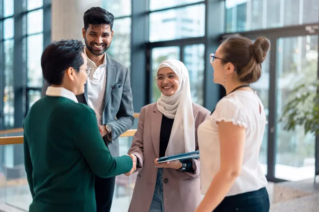 A group of people shaking hands