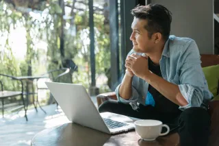 A man sitting happily looking out of the window