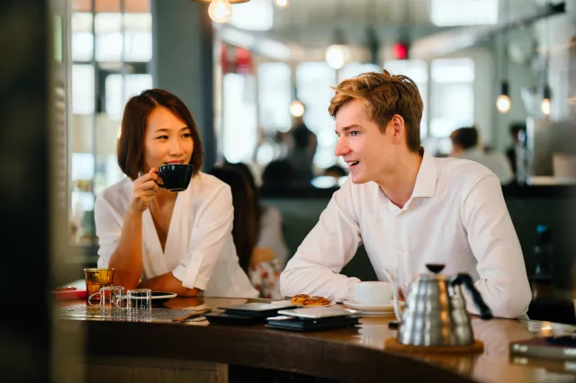 2 professionals networking over coffee