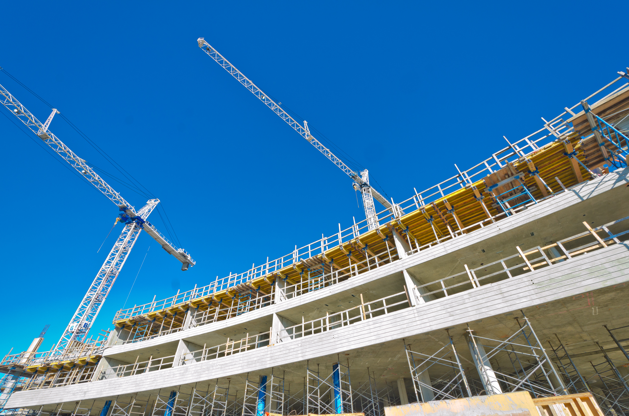 High rise building under construction with cranes